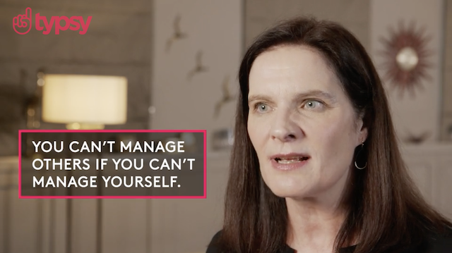 A woman with straight brown hair discusses time management in a Typsy course.