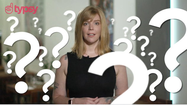 An image of a young woman surrounded by question marks in a Typsy training video.